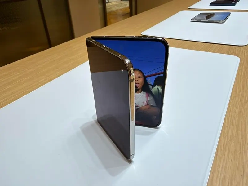 iPhone Duo in-store stock retail packaging displayed on an Apple Store table